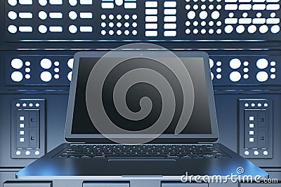 Close up of empty mock up laptop computer in illuminated server room interior. Internet, engineering and data concept. Editorial Stock Photo