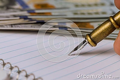 Close up of empty notepad a pen on the dollars Stock Photo