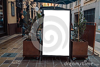 Close up of empty white poster near cafe or restaurant. Mockup Editorial Stock Photo
