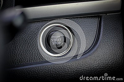 Close up engine car start button. Start stop engine modern new car button,Makes it easy to turn auto mobile on and off. a key fob Stock Photo