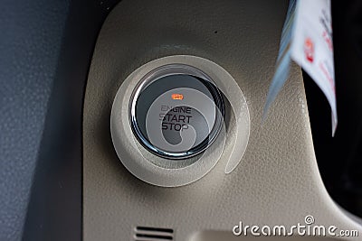 Close up engine car start button. Start stop engine modern new car button Stock Photo