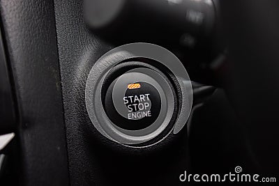 Close up engine car start button. Start stop engine modern new car button,Makes it easy to turn your auto mobile on and off. a key Stock Photo