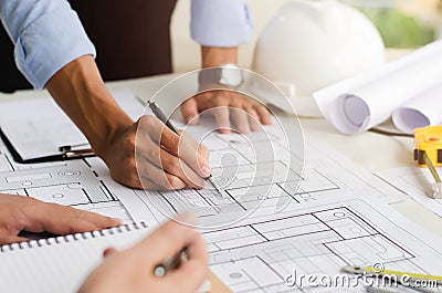 Close-up of an engineer planning a hand-drawn design. with architect equipment Architects talking at Stock Photo