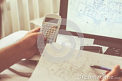 Close up of engineers hands working on table, he drawing project sketch in construction site or office Stock Photo