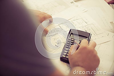 Close up of engineers hands working on table, he drawing project sketch in construction site or office Stock Photo