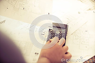 Close up of engineers hands working on table, he drawing project sketch in construction site or office Stock Photo