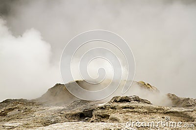 Erupting geyser in Upper Geyser Basin, Yellowstone National Park Stock Photo