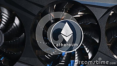 Close up of Ethereum coin on a black grafic video card. Cryptocurrency business device. Ethereum miners Editorial Stock Photo