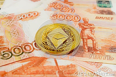 Close-up of Ethereum coins on 5000 Russian rubles banknote. Crypto currency ETC Editorial Stock Photo