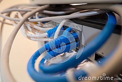 Close-up of Ethernet cable pluged on network switch, UTP cabling and computer network Stock Photo