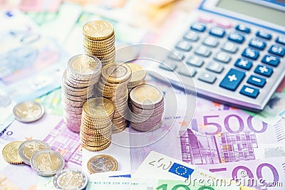 Close-up euro coins and banknotes with calculator Stock Photo