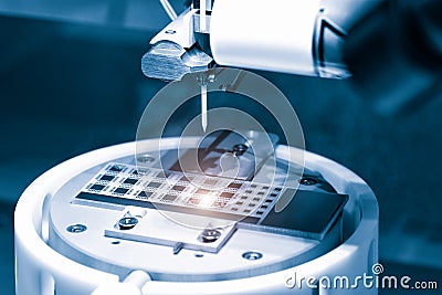 Close up of examining of test sample of microchip transistor under the microscope in laboratory. Equipment for testing microchips. Stock Photo