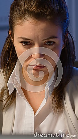 Close up of exhausted manager working overtime to respect deadline Stock Photo