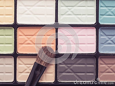 Close up eye make up brush on colorful eye shadow Stock Photo