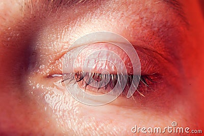 Close-up blue eye of a woman with a tear. People and emotions concept Stock Photo