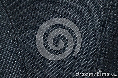 Close up fabric texture of upholstered luxury armchair. Premium stitching and crosshatched pattern on sofa surface. Stock Photo