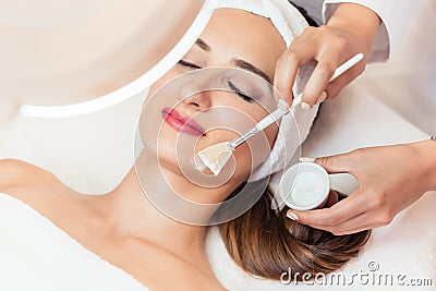 Close-up of a beautiful woman relaxing during facial treatment in beauty center Stock Photo