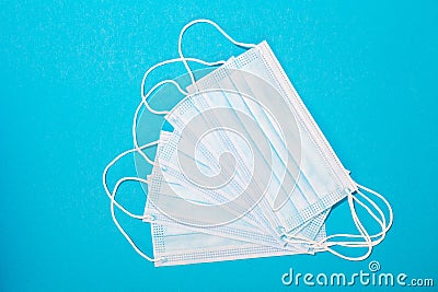 Close-up of facemasks on blue background Stock Photo