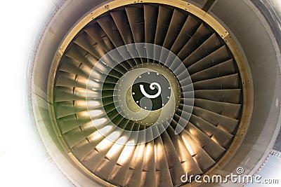 Close up of fan engine and turbine blades of modern civil passenger airplane illuminated beautiful light Stock Photo