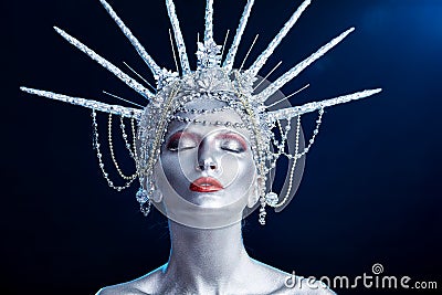 Close up fashion portrait of a woman with body paint looking like a Statue of Liberty Stock Photo