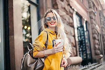 Close up fashion street stile portrait of pretty girl in fall casual outfit Beautiful blond posing outdoor. Stock Photo