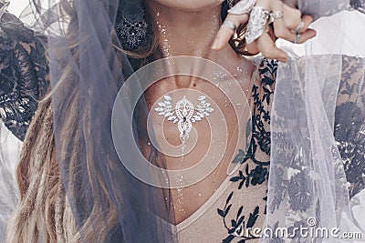 Close up of fashionable stylish woman with boho accessories outdoor Stock Photo