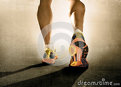 Close up feet running shoes and strong athletic legs sport man jogging fitness training workout Stock Photo