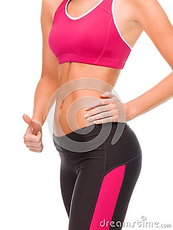 Close up of female abs and hand showing thumbs up Stock Photo