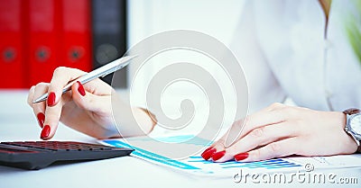 Close up of female accountant or banker hand making calculations. Savings, finances and economy concept Stock Photo