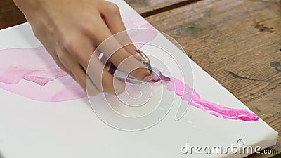 Close Up of Female Artist Paints an Abstract Picture, he Uses Pink ... image pic photo