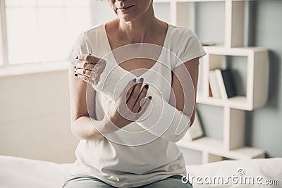 Close-up of Female Broken Arm in Plaster Cast Stock Photo