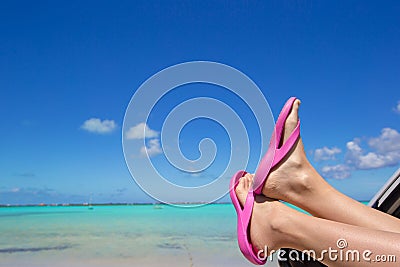 Close up female flip flops from the window of a Stock Photo