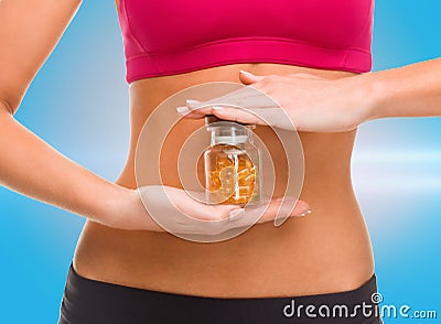 Close up of female hands with bottle of capsules Stock Photo