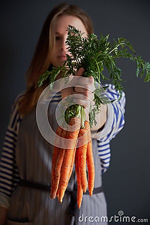 Bunch of fresh carrots with haulm Stock Photo