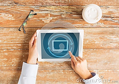 Close up of female hands with tablet pc and coffee Stock Photo