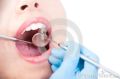 Close up of female patient having teeth examination by stomatologist Stock Photo