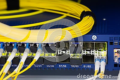 Close up fiber optic in server room , network cables installed in the rack Abstract image for use as a background Stock Photo