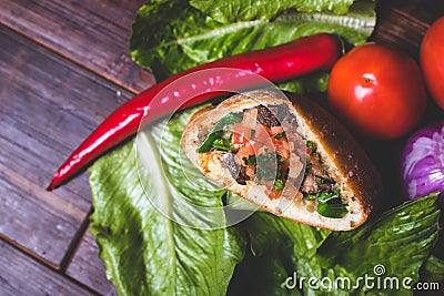 A close-up of a filling of a baked patty. Stock Photo