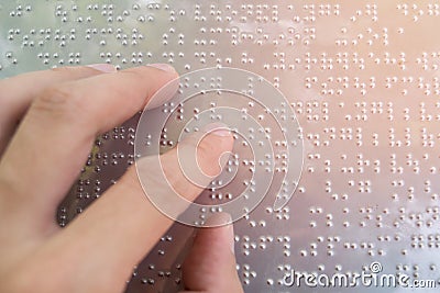 Close up finger touch to braille Code Stock Photo