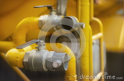 Close up for fireman hands in special gloves connecting fire hose with water tank Stock Photo