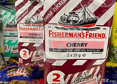 Close up of Fisherman s friend cherry candies packs in shelf of german supermarket Editorial Stock Photo