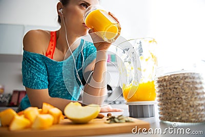 Close-up on fit woman drinking pumpkin smoothie Stock Photo