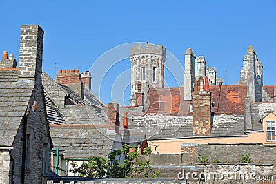 Close-up on flagstone roofs with the Victorian building Purbeck House Hotel in the background, Swanage Stock Photo