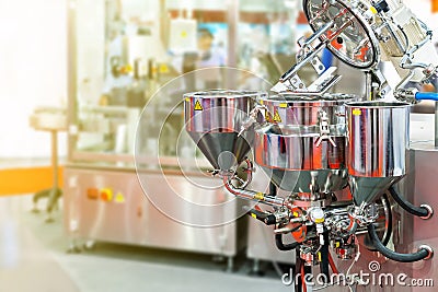 Close up flat beater and barrel and discharge system of automatic and modern food or beverage commercial mixer machine for Stock Photo