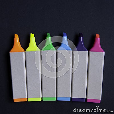 Close-up of flat colorful markers on black background Stock Photo