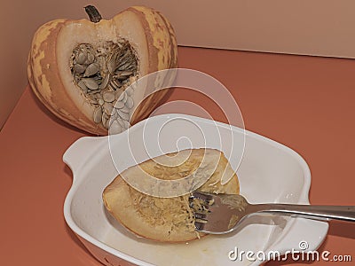Eating Baked Carnival Squash with Butter Stock Photo