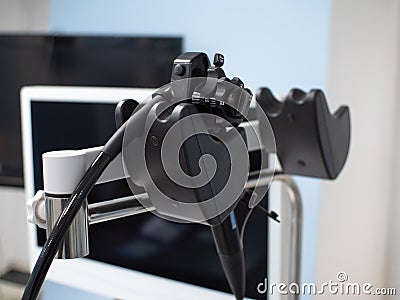 Close-up of the flexible endoscope's probe control apparatus. The gastroscope probe hangs on a special hook Stock Photo