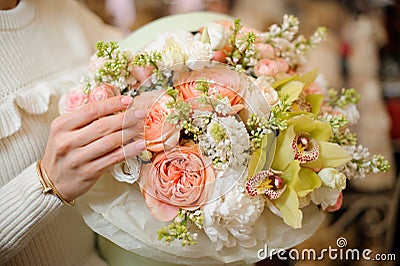Close-up of flower arrangement of fresh orchids, roses, peonies and white lilacs Stock Photo