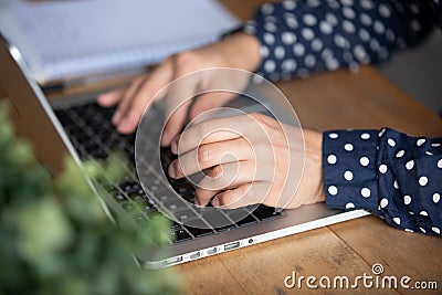 Young indian student writing essay in laptop program. Stock Photo