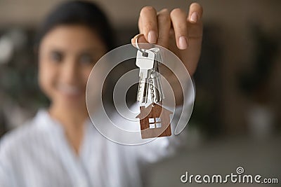 Close up focus on keys, excited tenant rejoicing relocation Stock Photo
